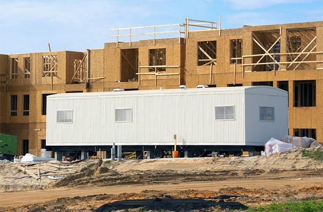 crane lifting modular building for construction office rentals in Artesia, CA